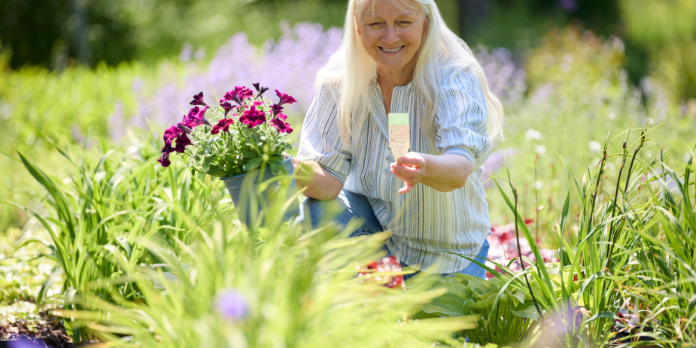 Dig Marketing-Sherwood Park-Alberta-Speak Easy-woman reads plant tag in garden center